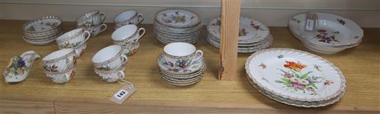 A 19th century Meissen model of a slipper, two Meissen plates, c.1760-1800 and a Dresden part tea set